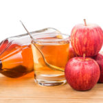 Apple cider vinegar in jar, glass and fresh apple, healthy drink.